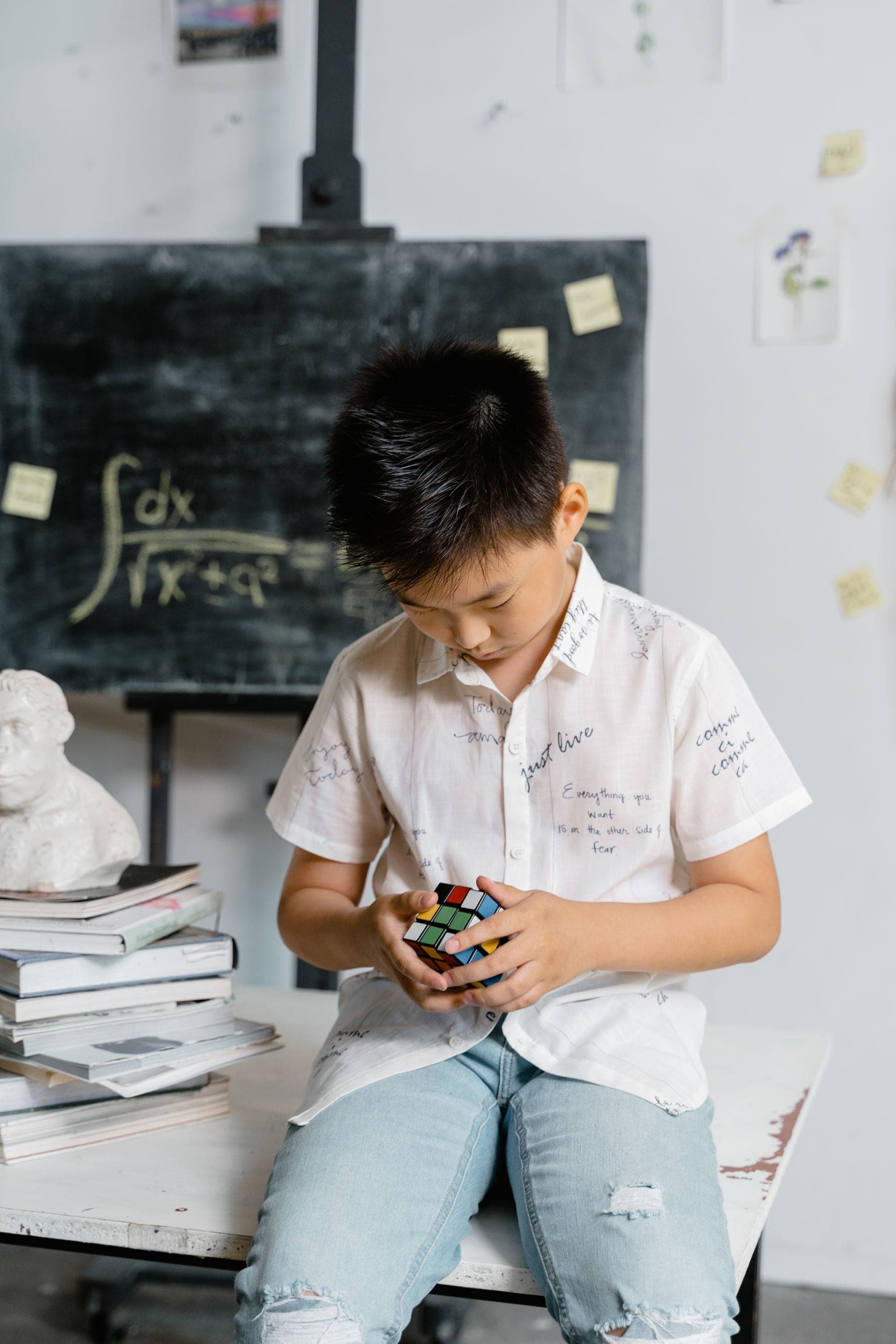Child practicing Rubik's Cube solving techniques